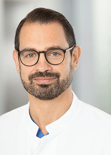 Portraitbild von Dr. med. André Schilling, MHBA